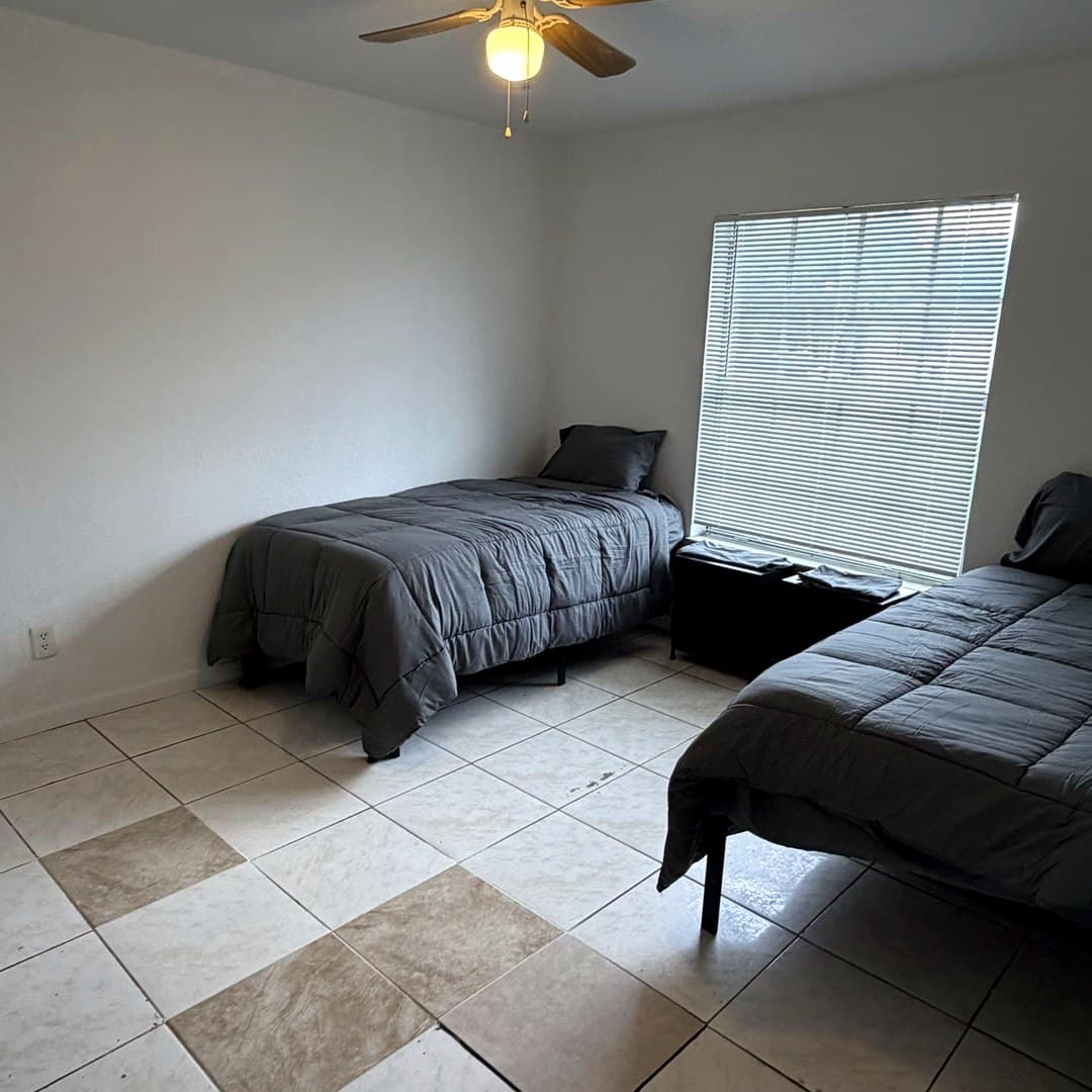 Furnished twin bedroom at Dania Haven II men's sober living home, Dania Beach FL