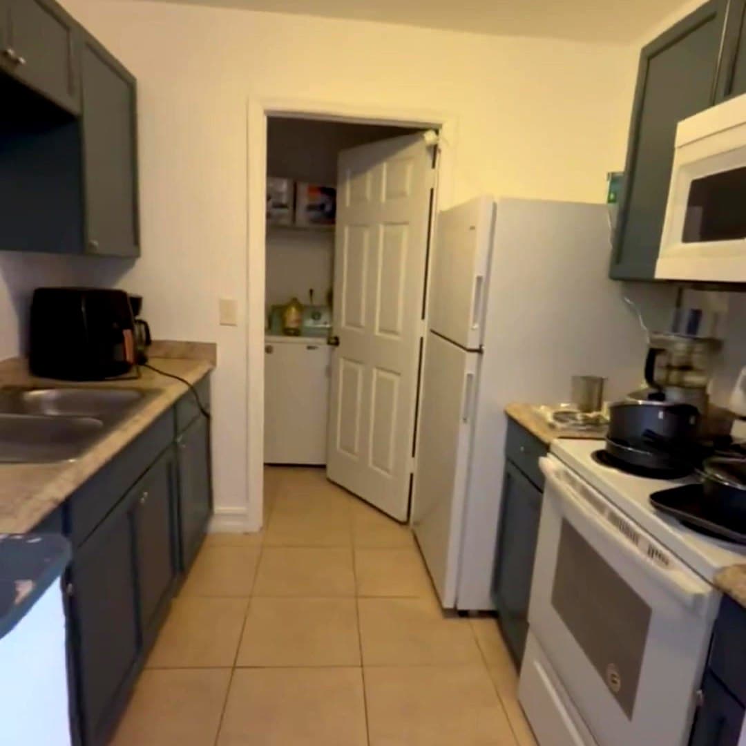 Shared kitchen and on-site laundry at Dania Haven II men's sober living home in Dania Beach, Florida