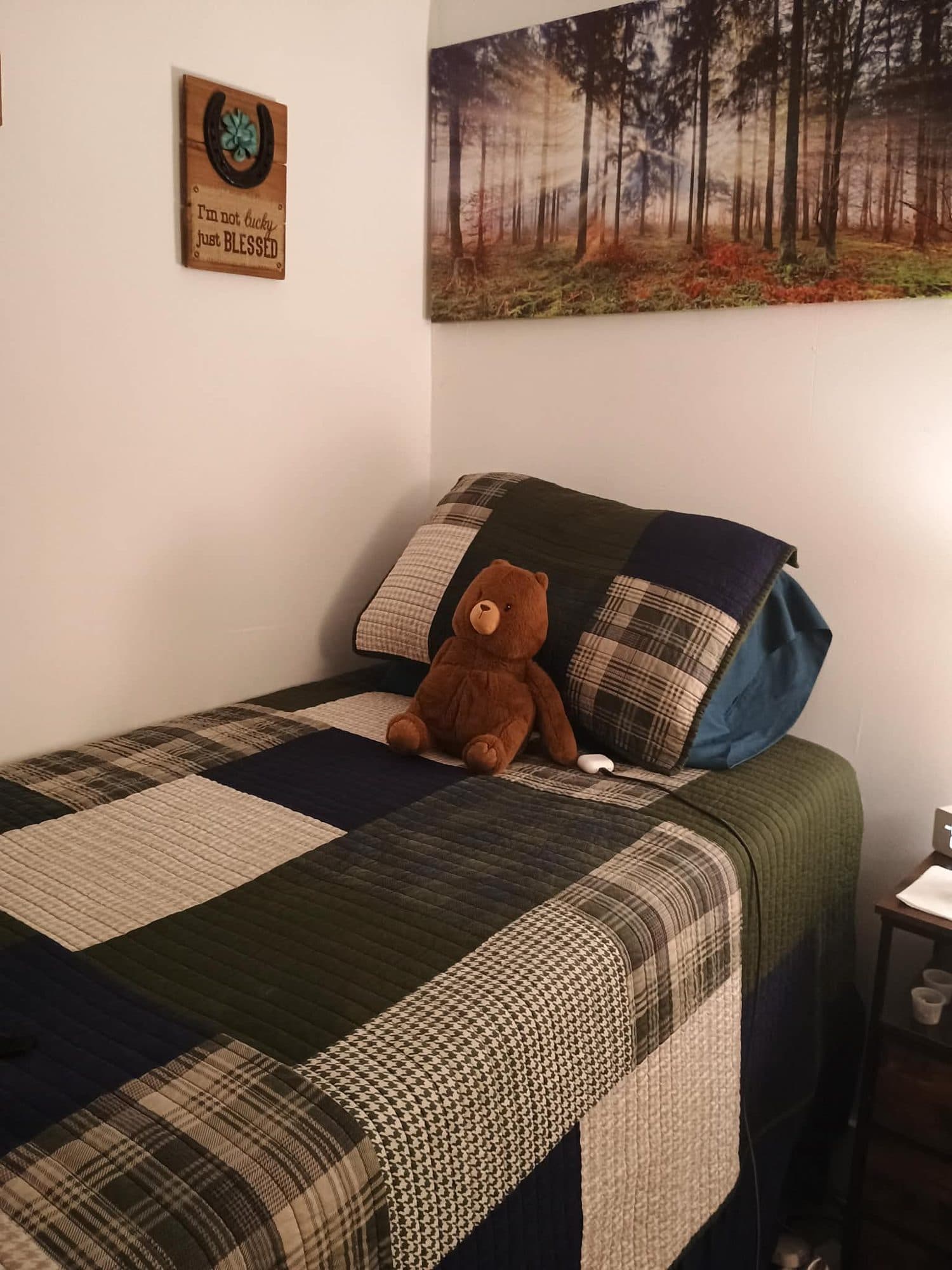 Furnished bedroom with made bed at Dania Haven women's recovery residence in Dania Beach, Florida