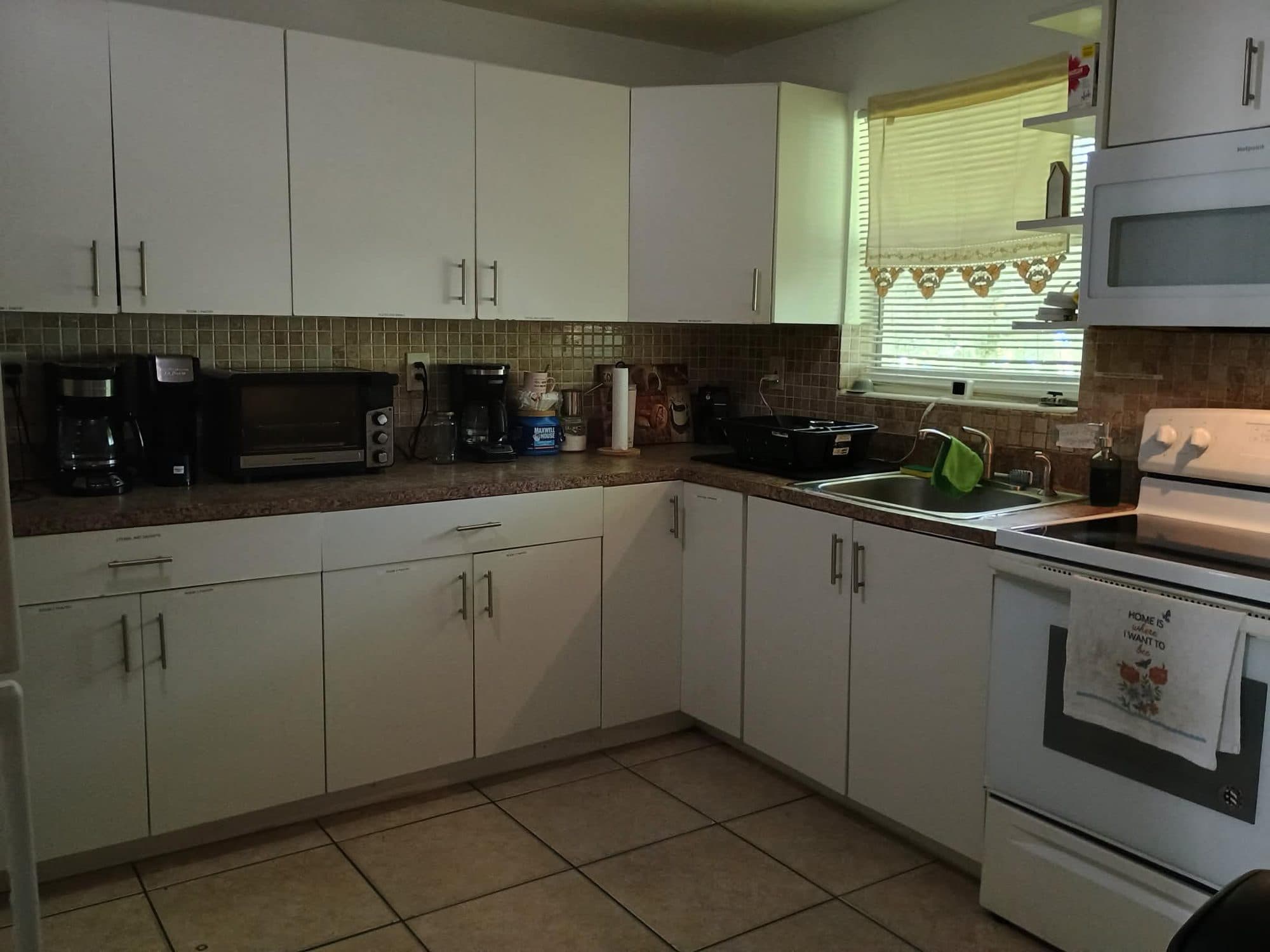 Shared resident kitchen at Dania Haven women's recovery residence in Dania Beach, Florida